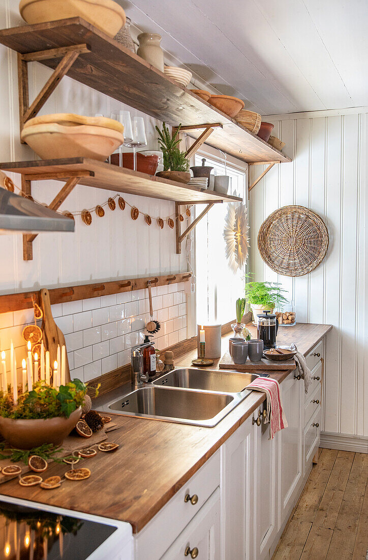 White country kitchen with open shelving and wooden accents