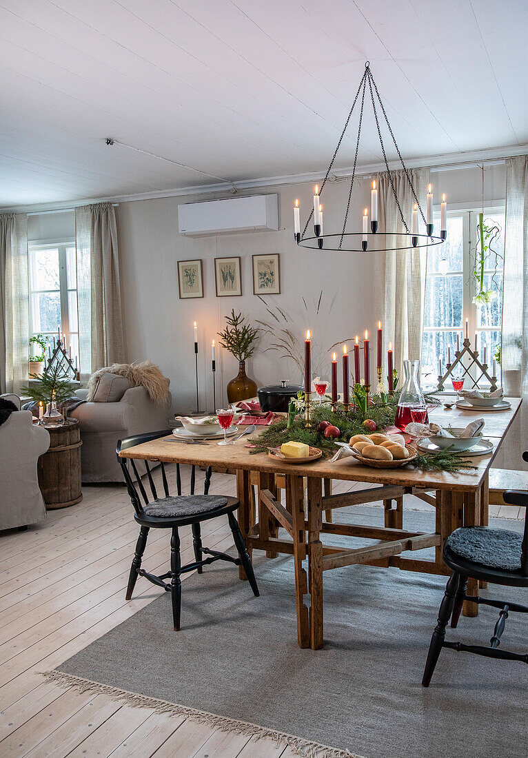 Rustic dining room with wooden dining table and metal candlestick