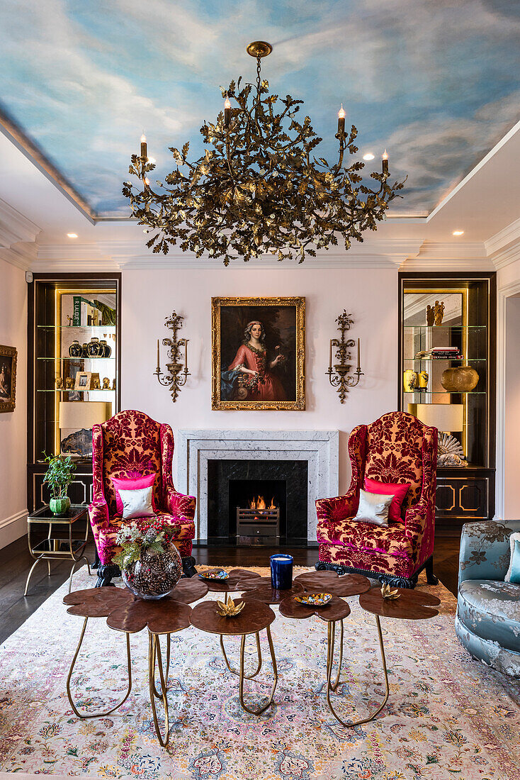 Baroque red velvet armchairs and trompe-l'œil sky in a London drawing room