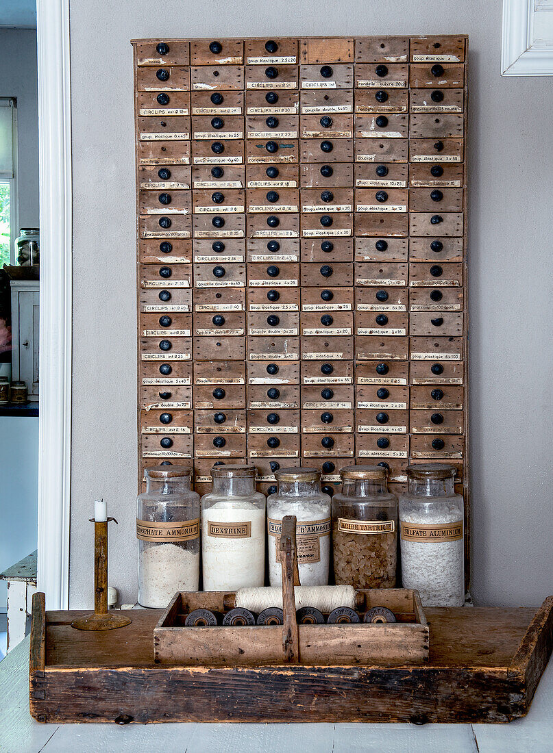 Vintage wooden box with numerous drawers and glass containers