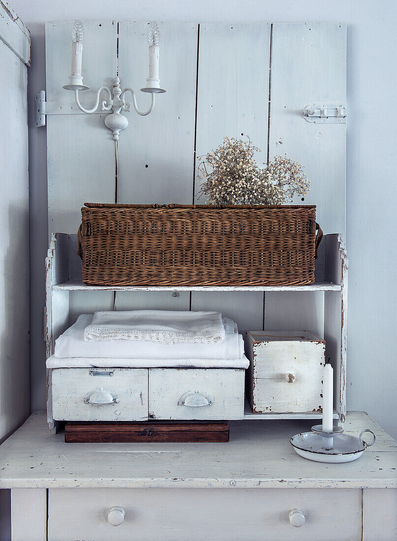 Vintage shelf with woven basket and dried flowers