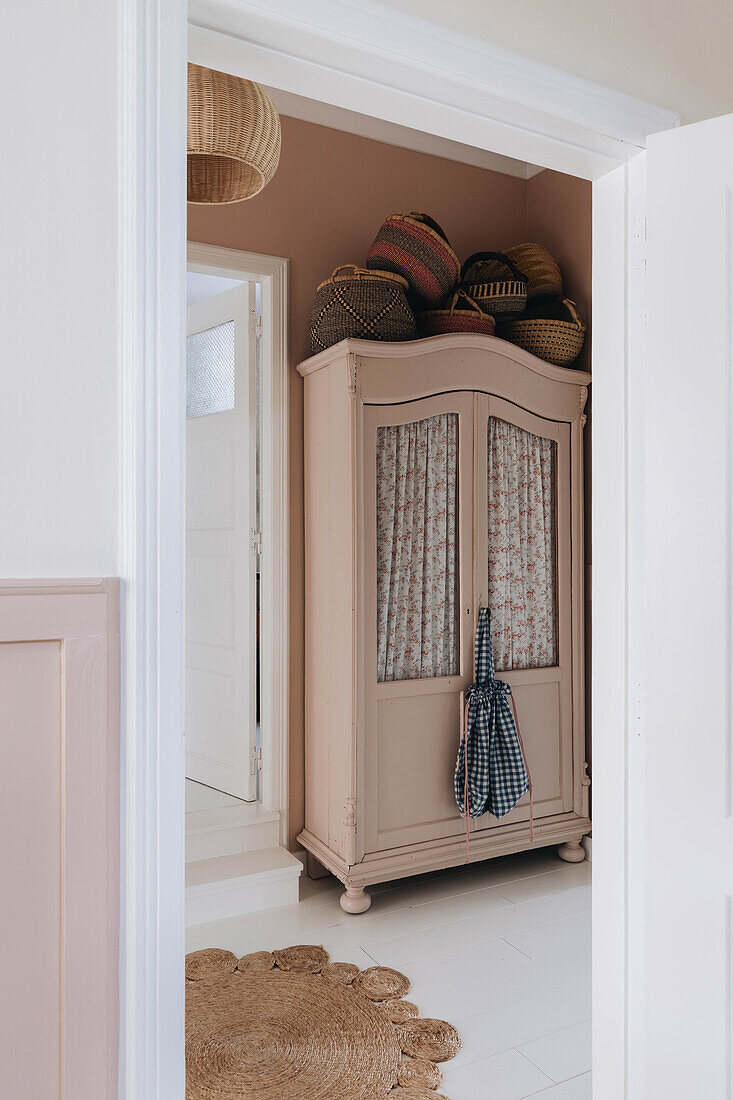 Old cupboard in the hallway with wickerwork