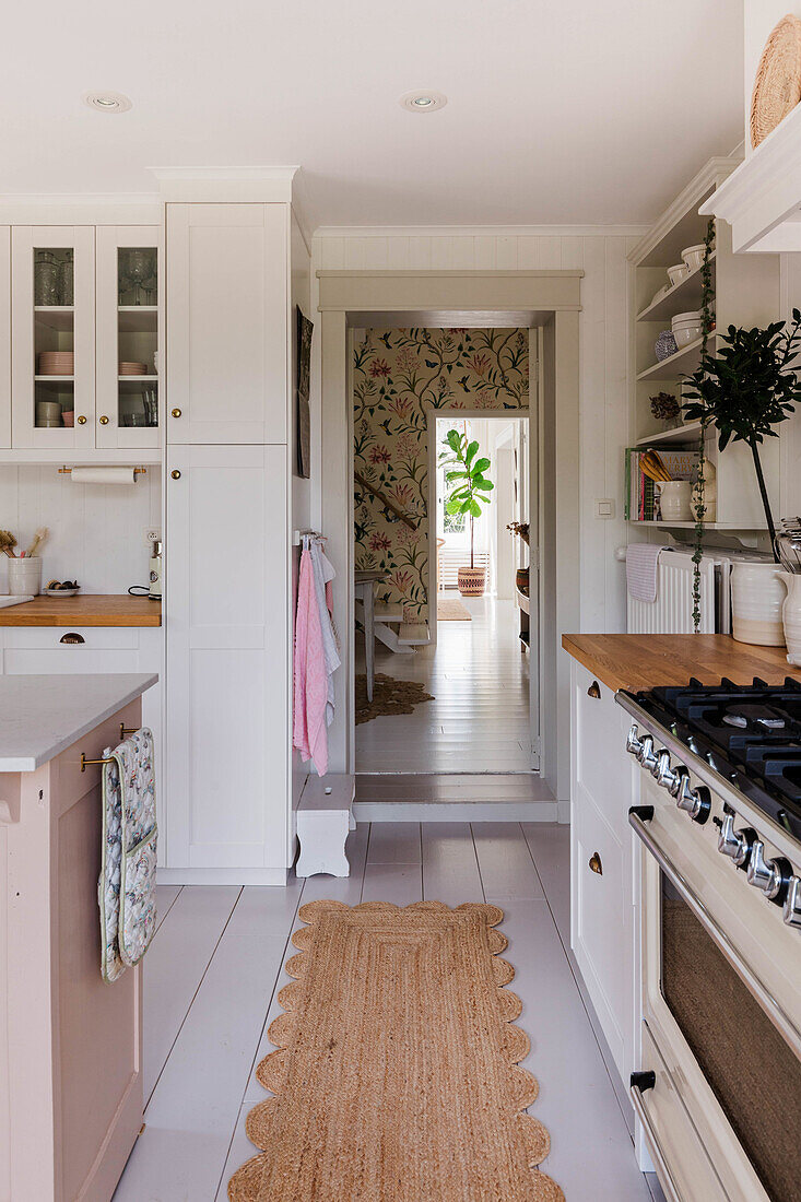 Bright country kitchen with wooden worktop and sisal runner