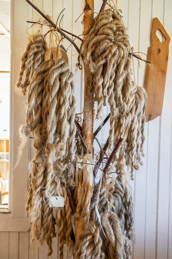 Natural fibres on a branch, rustic ambience