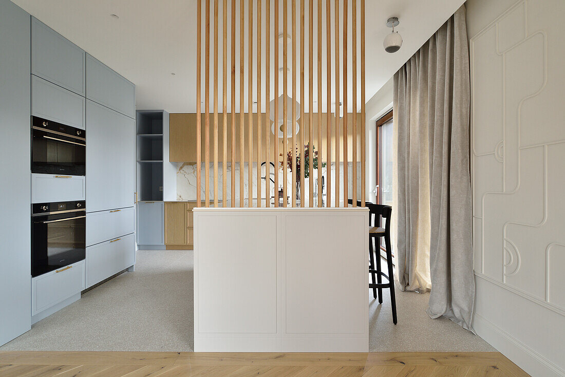 Modern kitchen with wooden partition wall in Warsaw
