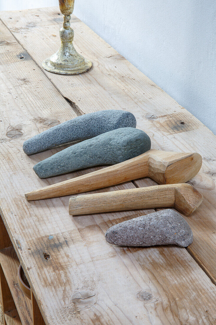 Wooden and stone appliances on a rustic wooden table