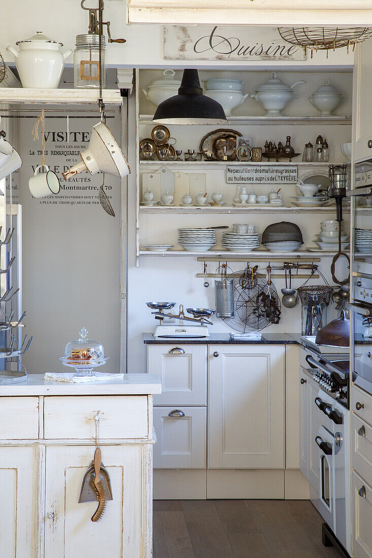 White country kitchen with open shelves and vintage decorations