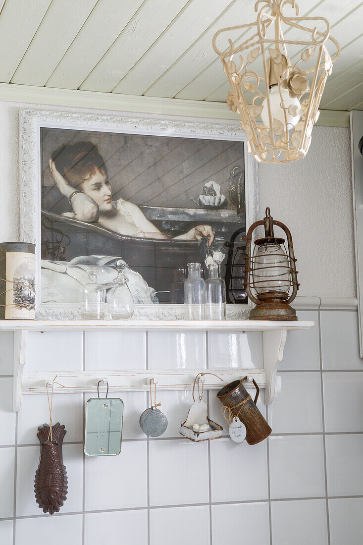 Vintage kitchen shelf with antique lamp and nostalgic picture