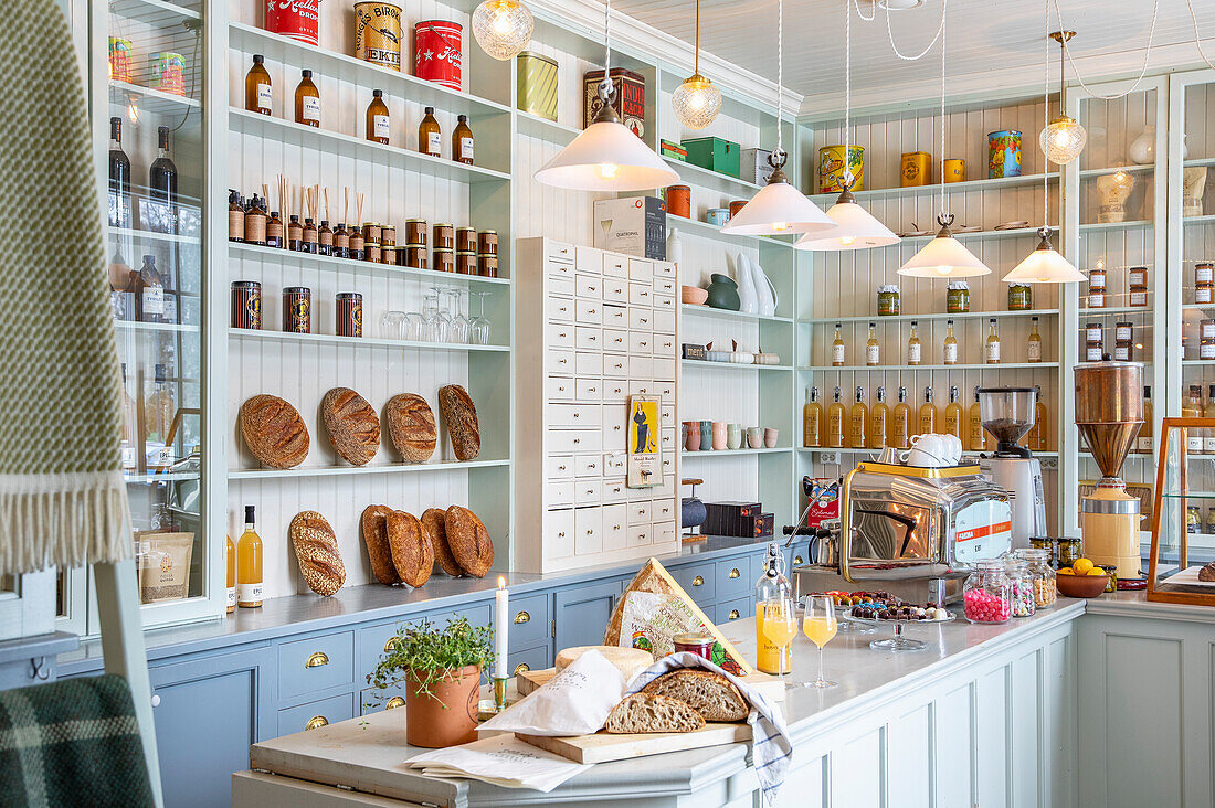 Bakery with open shelves filled with bread and groceries