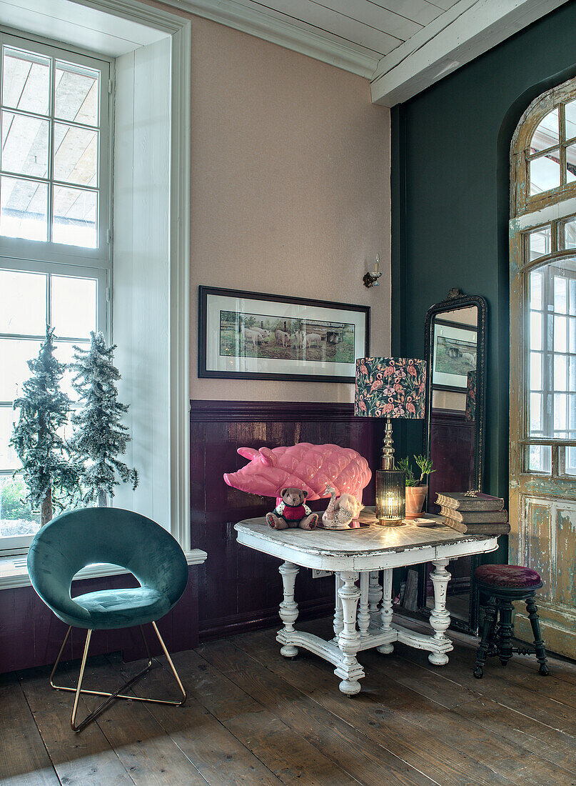 Vintage-style seating area with pink porcelain pig