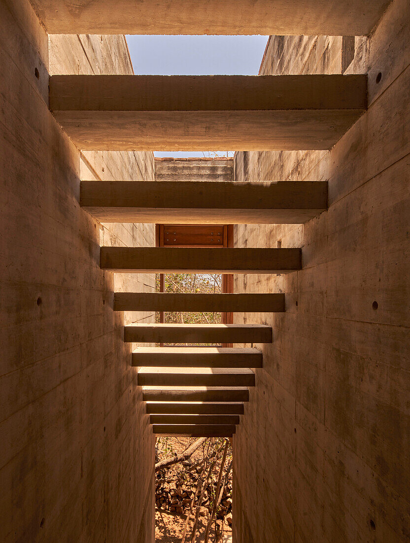 View from below of the concrete staircase in the guest wing of Casa Cometa, Mexico