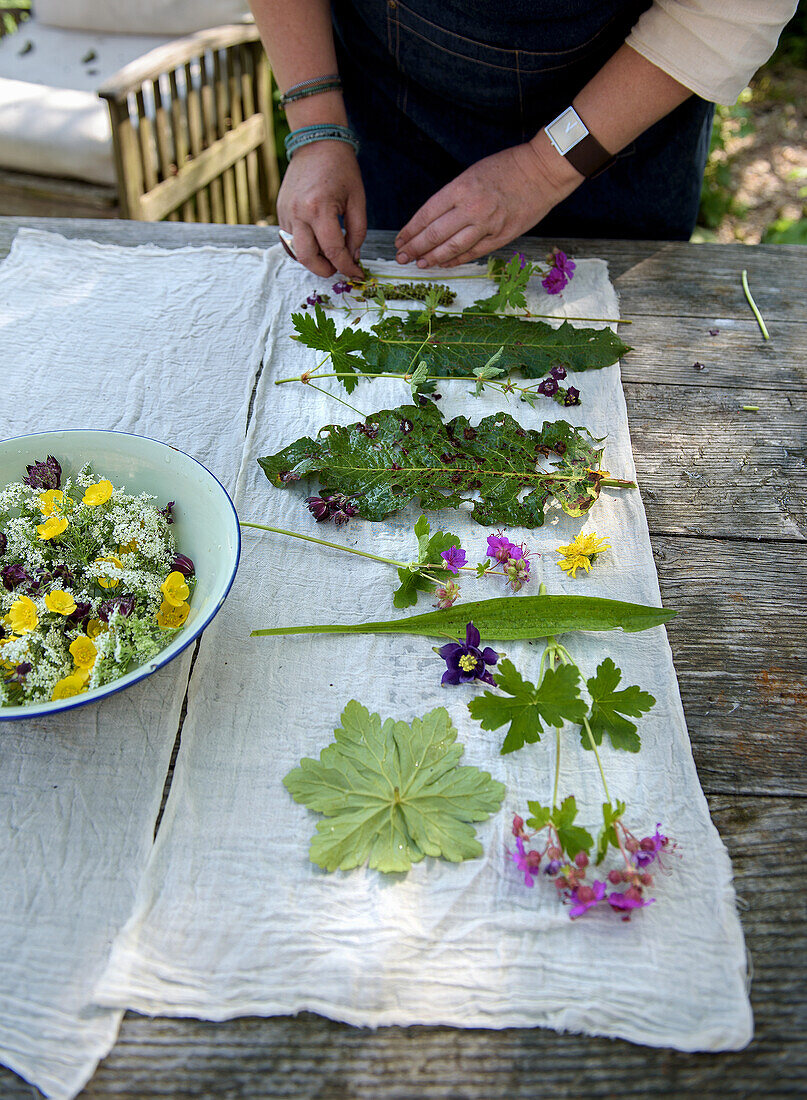 DIY project: pressing leaves and flowers, fresh flowers in bowl