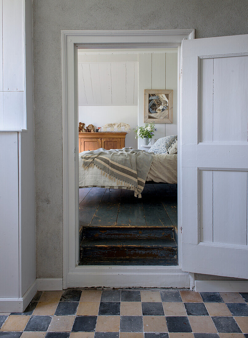 Bedroom with wooden floor and vintage decor