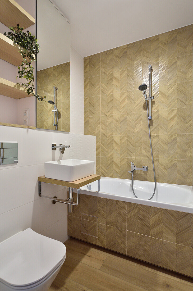 Modern bathroom with herringbone pattern tiles