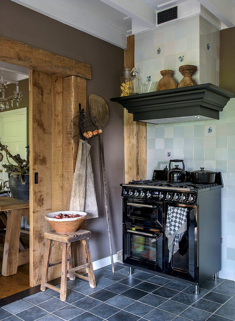 Country-style kitchen with black gas hob and rustic wooden elements