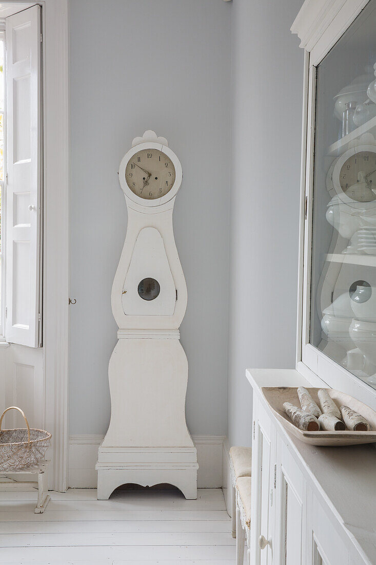 White grandfather clock with antique details