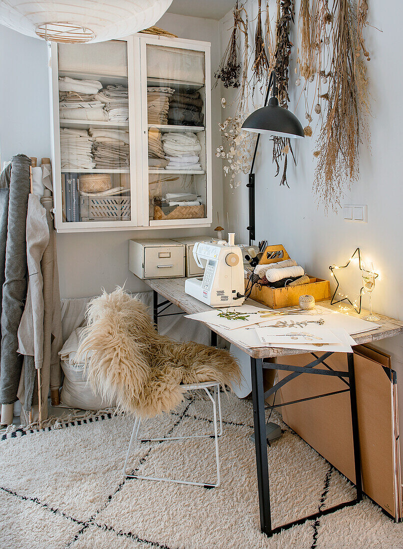 Sewing and craft room with dried flowers and sewing machine