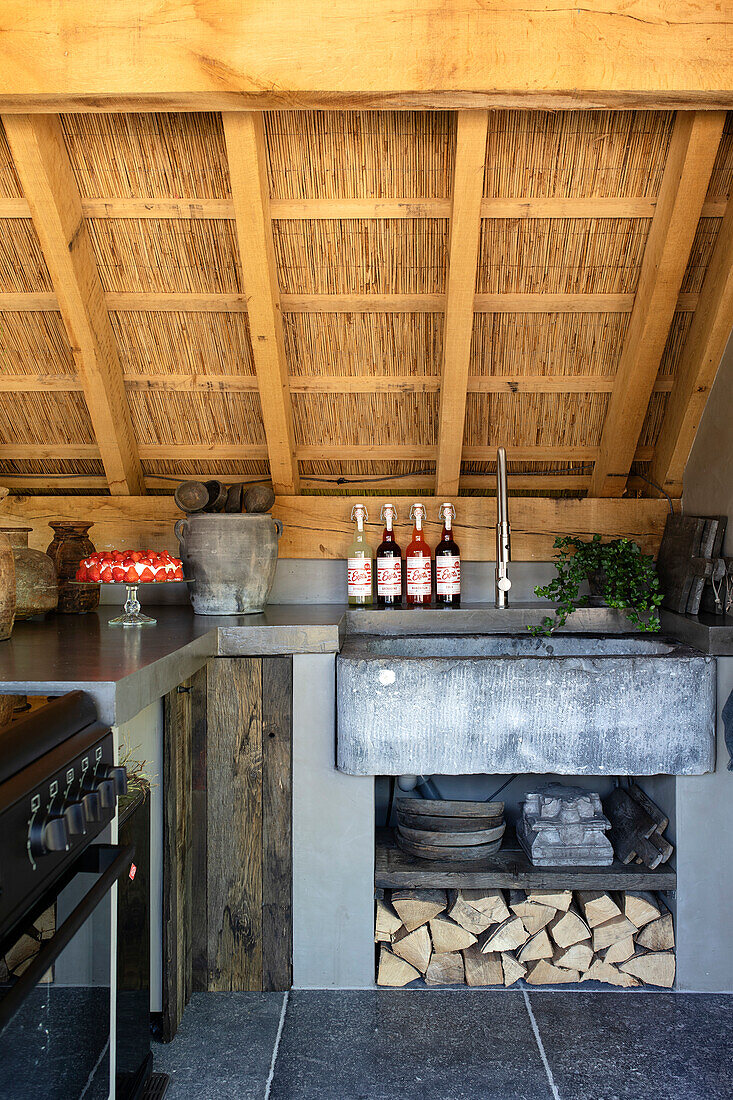 Outdoor kitchen with wood and stone elements