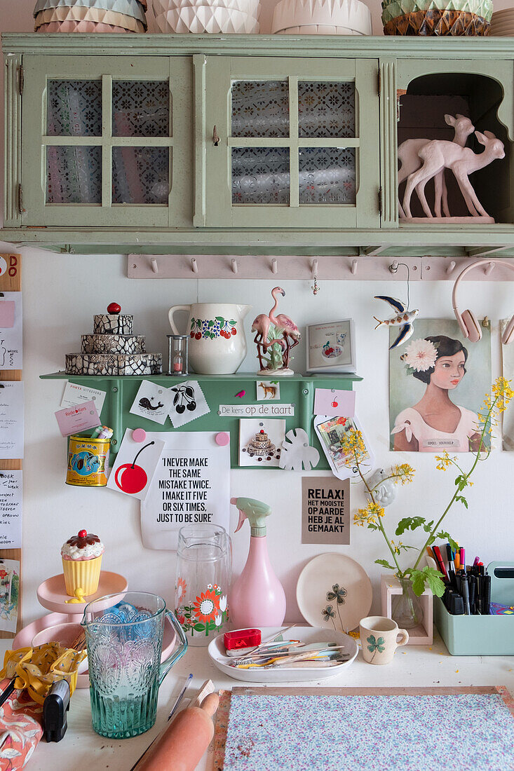 Decorative wall with green wall units and playful accessories