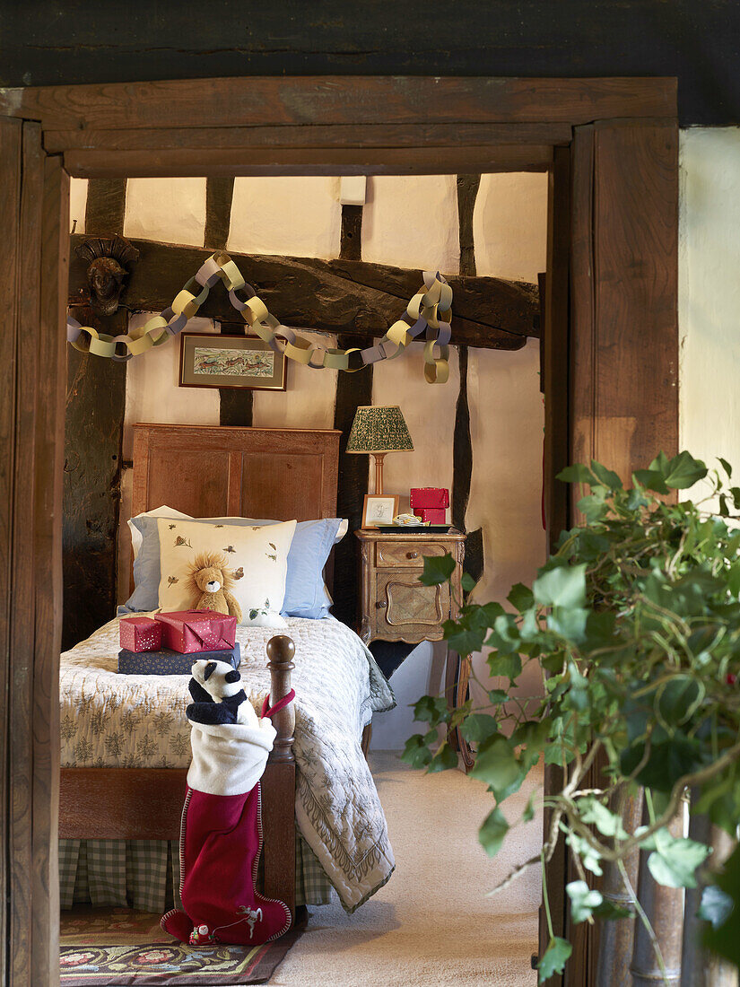 Rustic children's room with half-timbered beams and traditional Christmas decorations