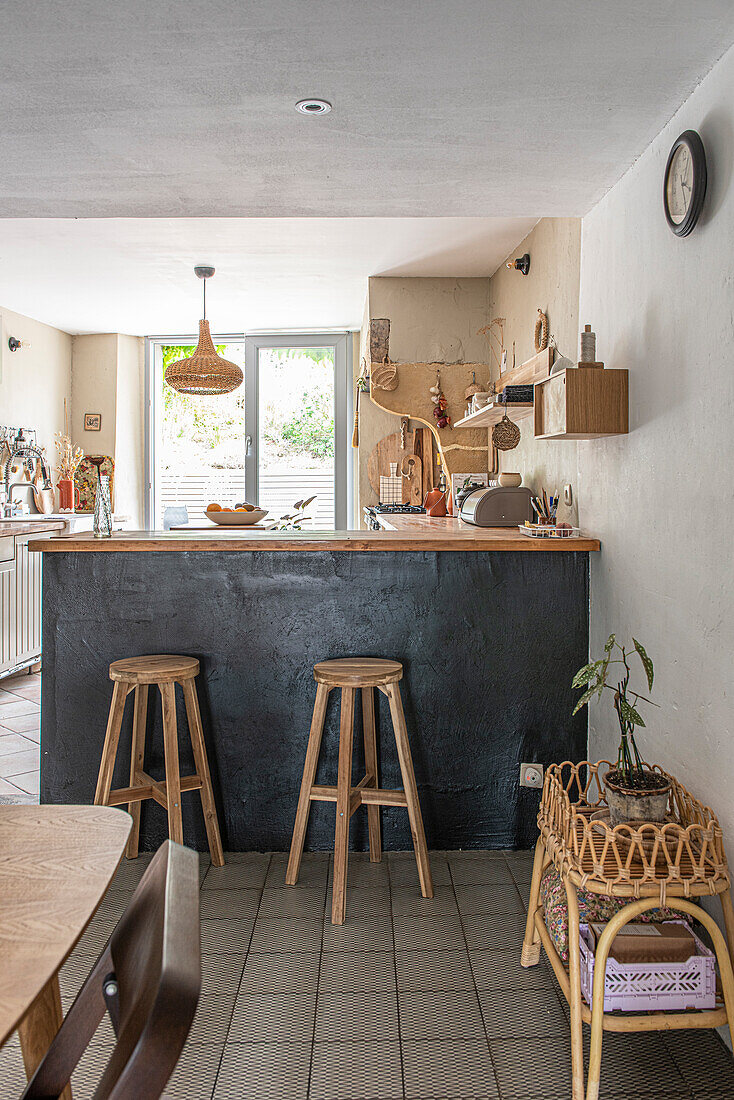 Kitchen bar with stools and pendant light