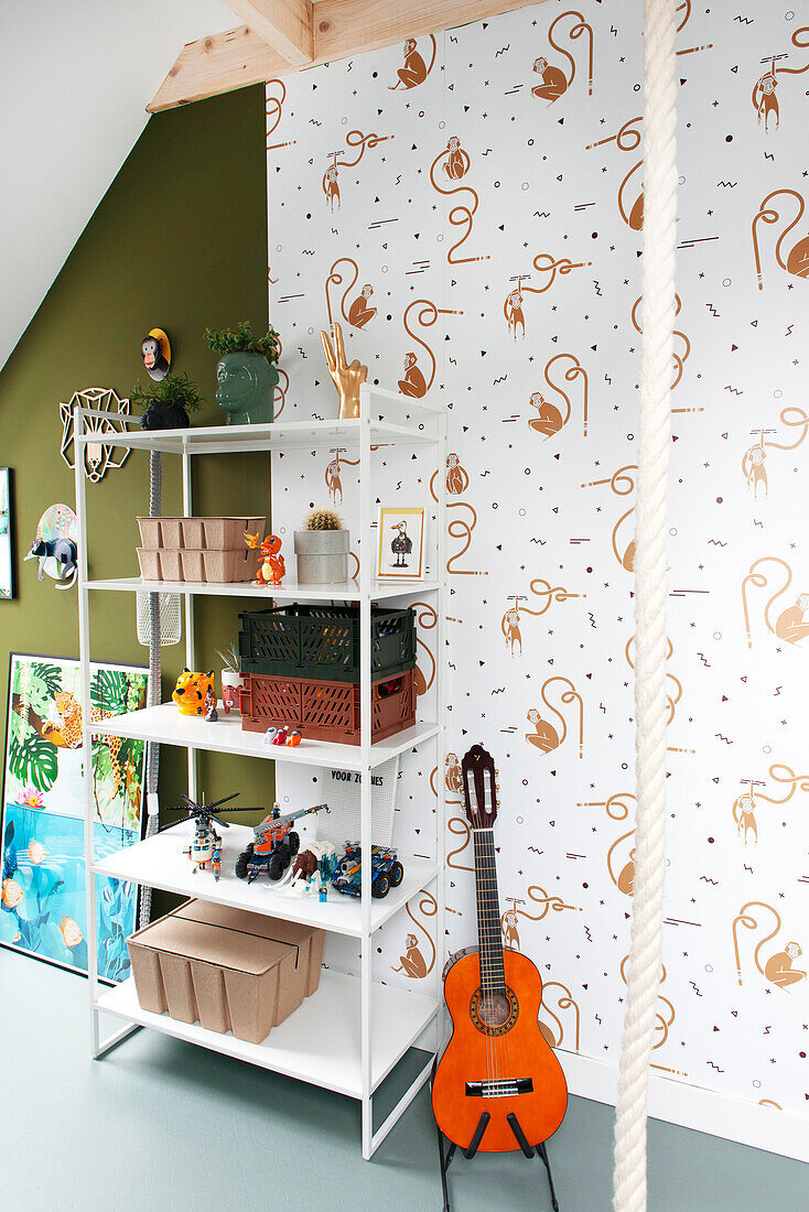 Children's room with wall shelf, toy collection and guitar on patterned wall