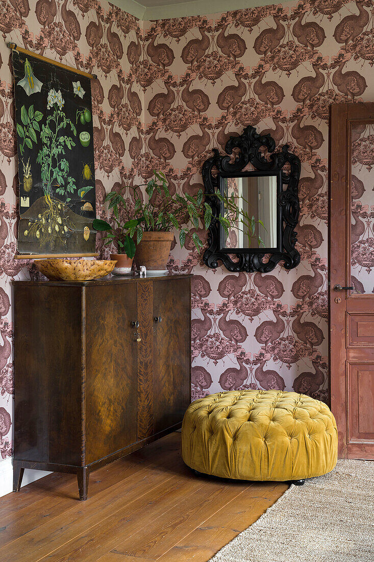 Vintage anteroom with baroque wallpaper, antique cabinet and yellow pouf