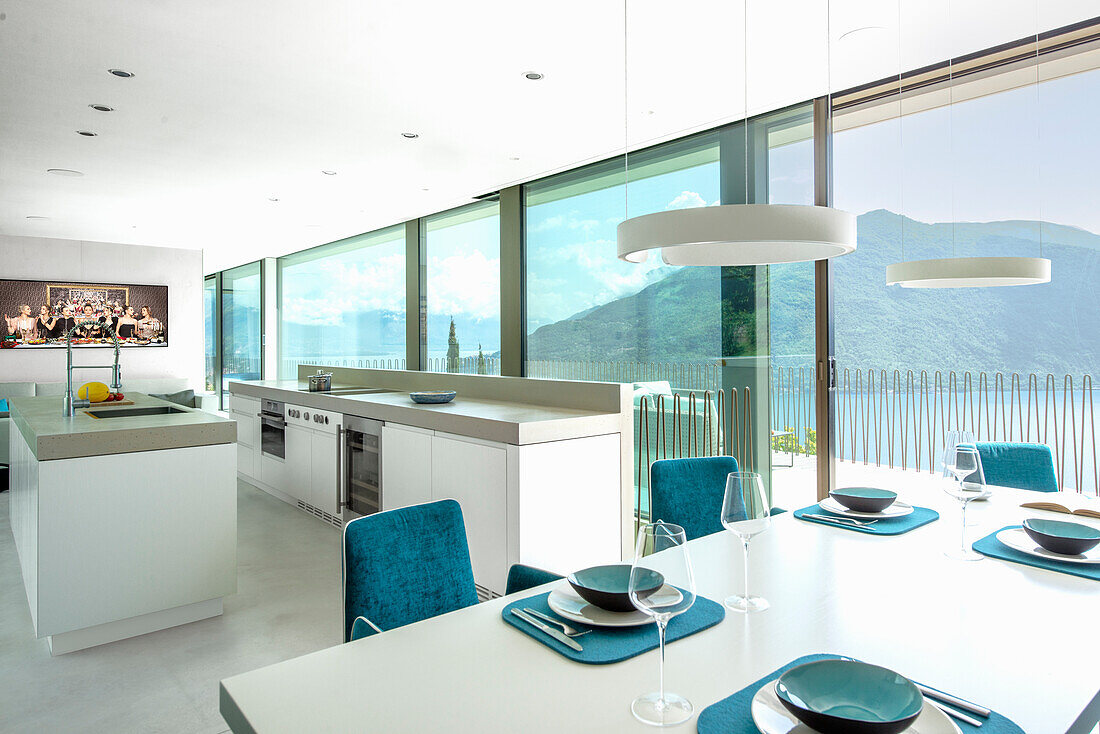 Modern kitchen with panoramic windows and a view of the mountains