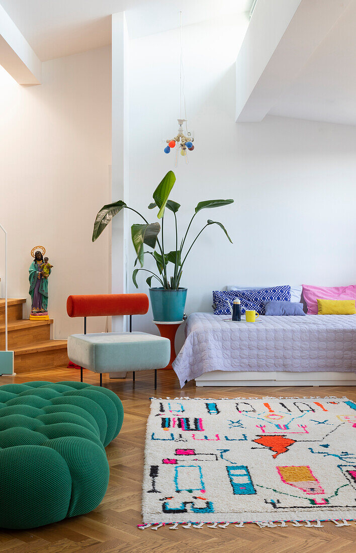 Bright living room with colourful accents and houseplant