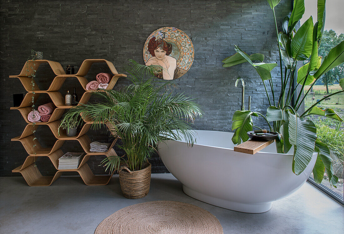 Modern bathroom with freestanding bathtub and plants