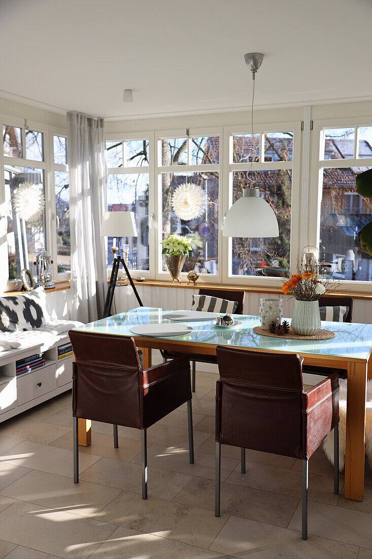 Light-flooded conservatory with dining area