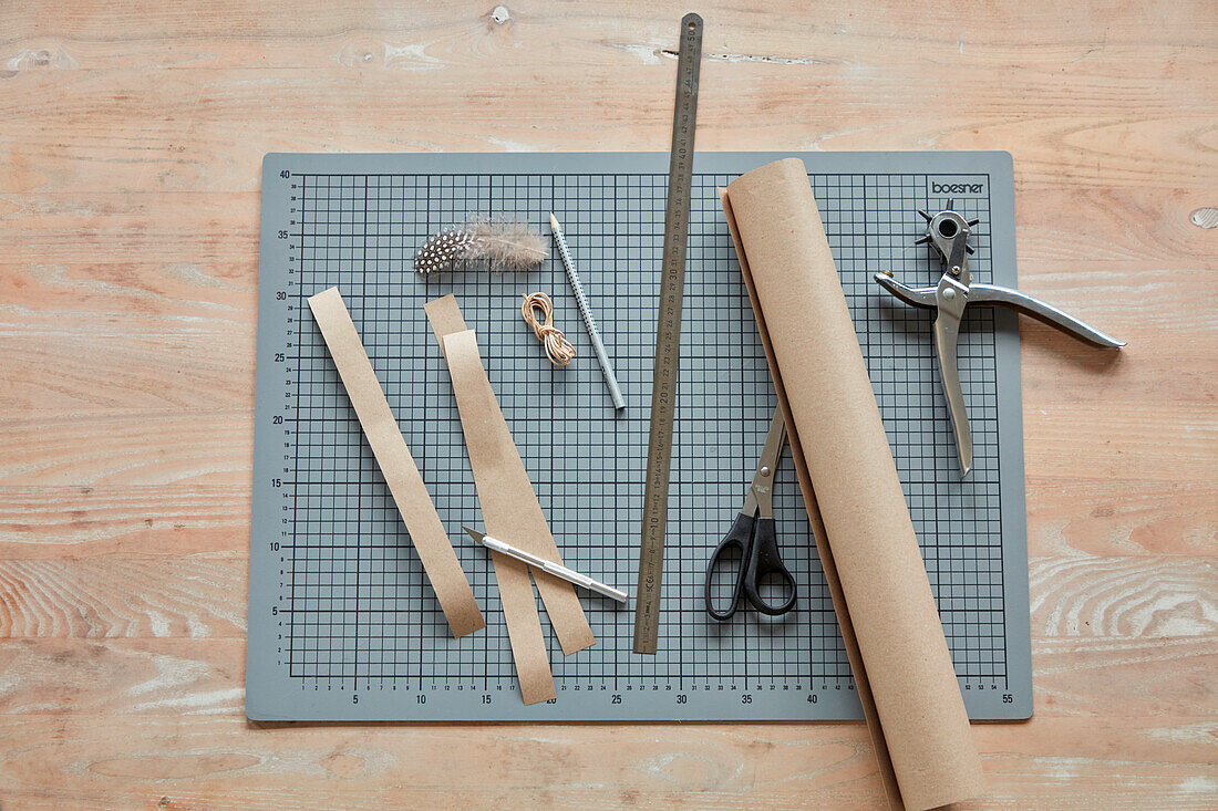 DIY craft kit with paper cutting mat, ruler, scissors and hole punch pliers