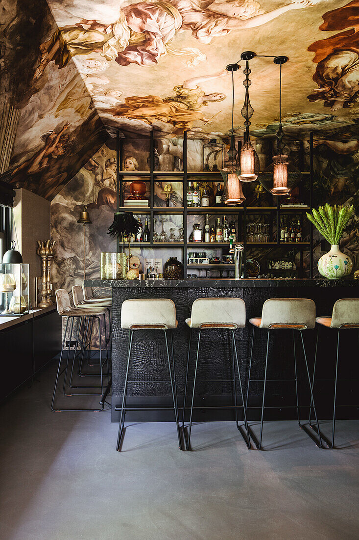 House bar with ceiling fresco and retro bar stools