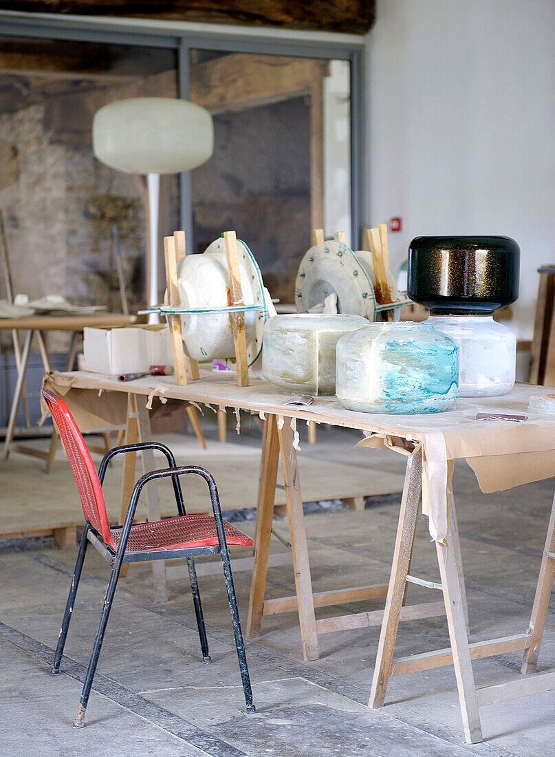 Work table in an artist's workshop for lamp design