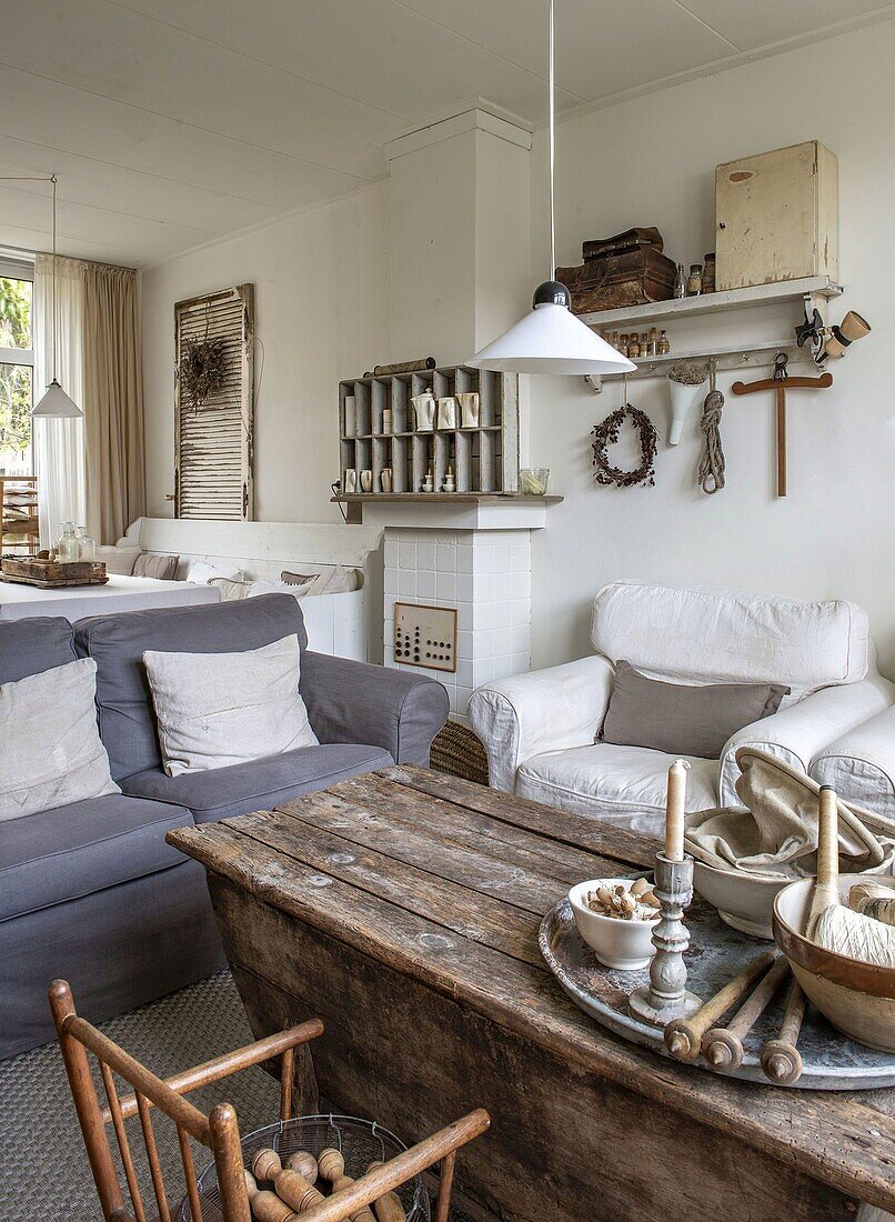 Country-style living room with rustic wooden table and candle holder