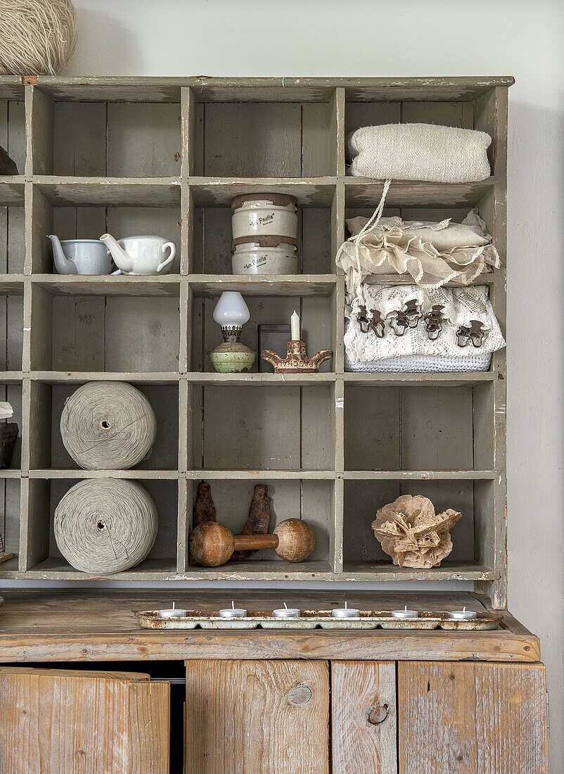 Rustic shelf with vintage items and candlestick