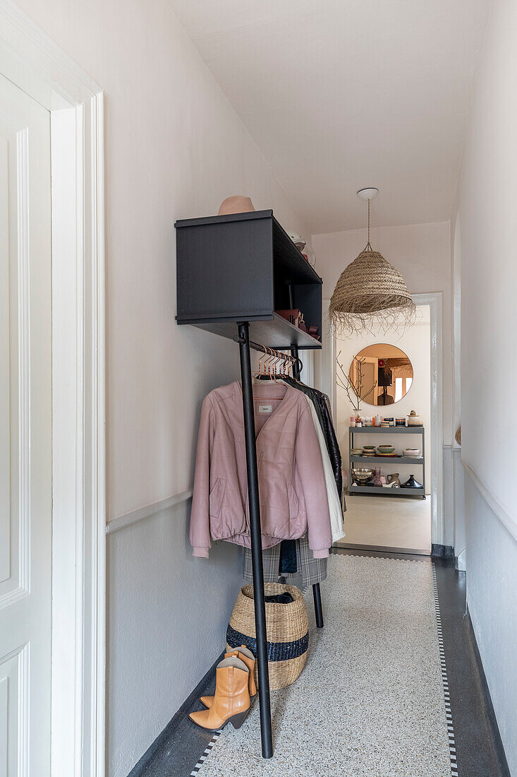 Hallway with wardrobe, rattan ceiling lamp and shelf