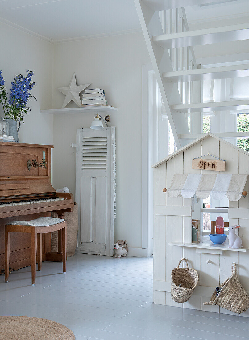 Playroom with mini wooden shop and piano