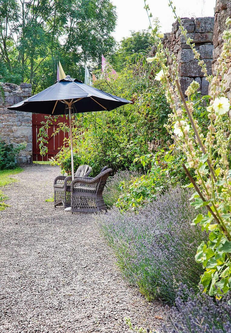 Seating on gravel path in the garden