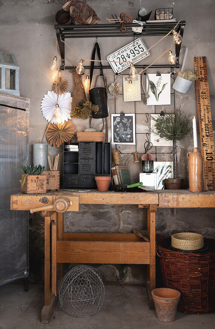 Workbench in rustic decor with fairy lights and craft materials