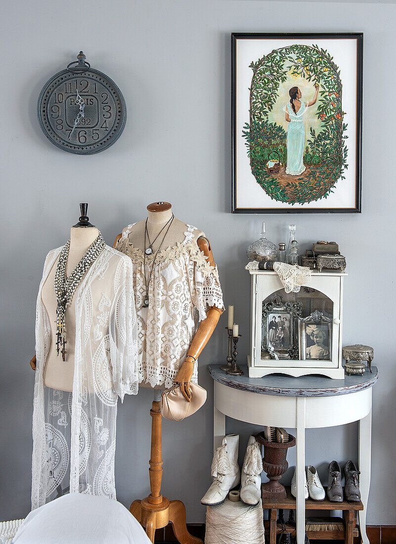 Decorative corner with dressmaker's dummies and vintage-style lace clothing