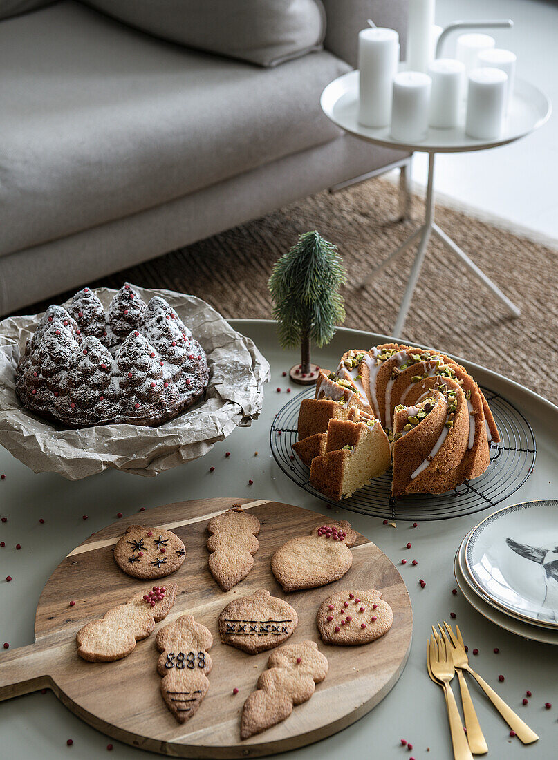 Christmas decorated coffee table with cake and biscuits