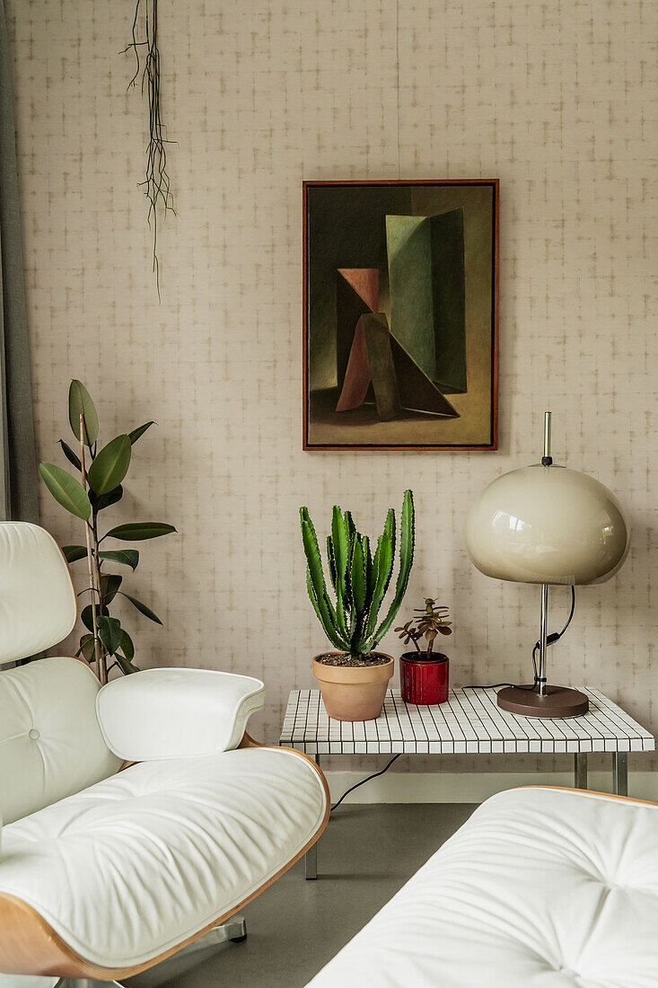 Modern living room with lounge chair and houseplants