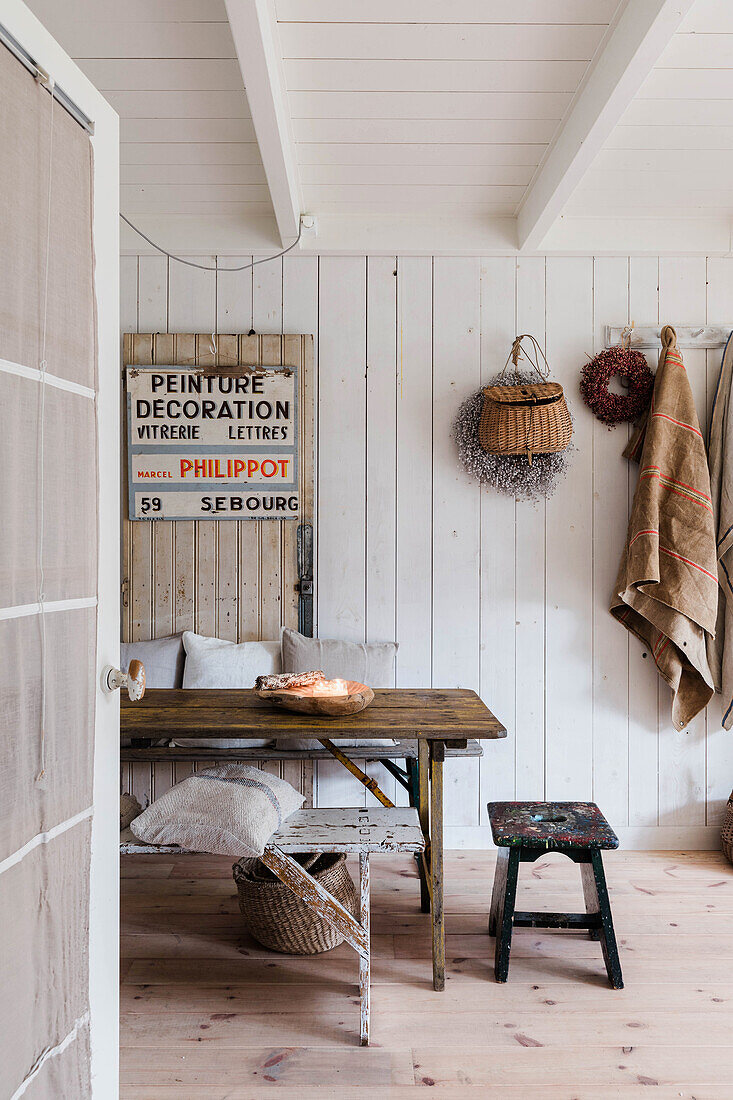 Rustic dining area with wooden table and vintage decorations