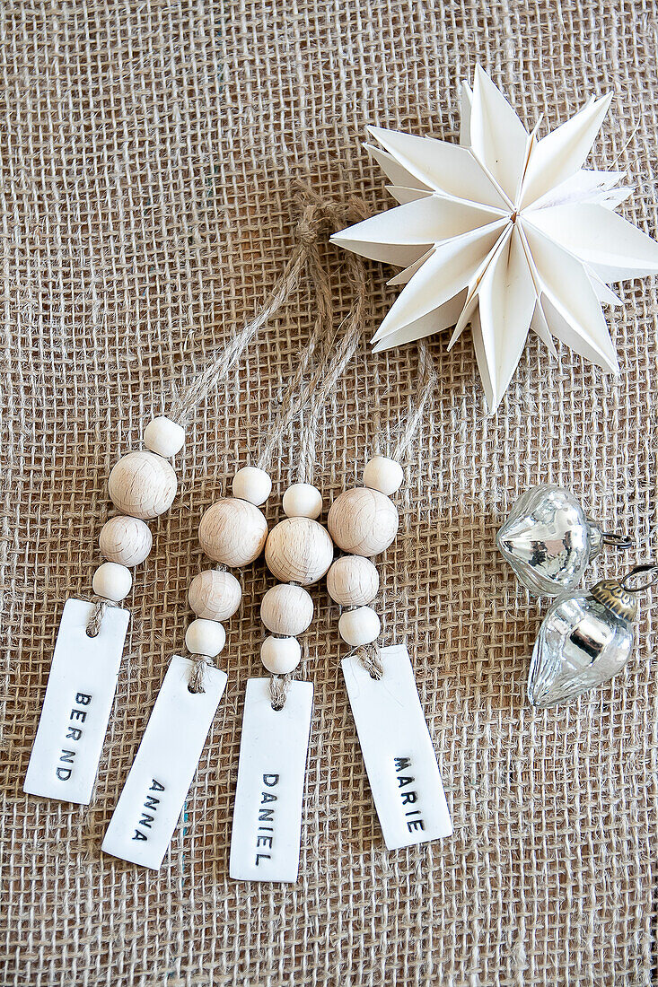 Name tag with wooden beads on jute fabric