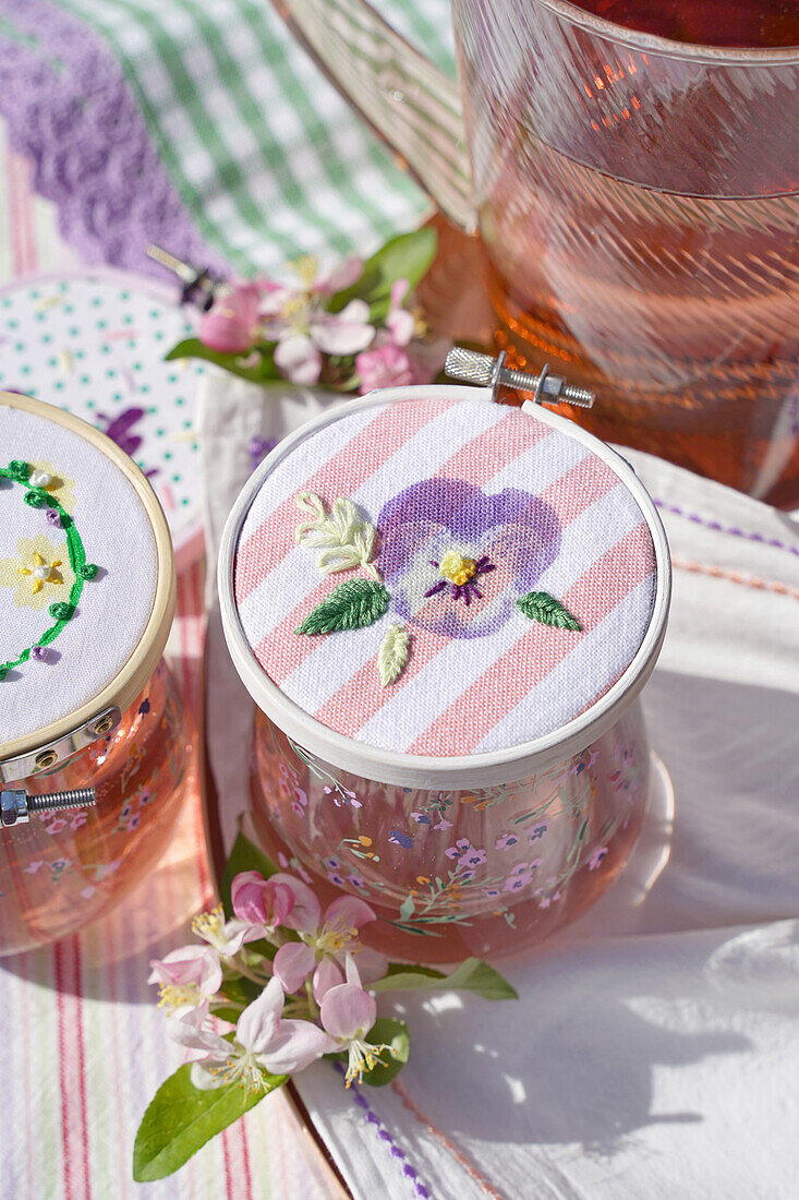 DIY drink lid with embroidery and floral print