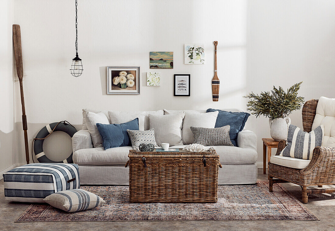 Maritime-style living room with rattan basket and rattan armchair