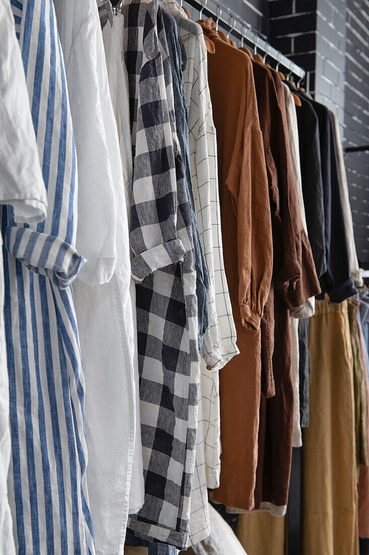 Close-up of linen clothes on wardrobe rail