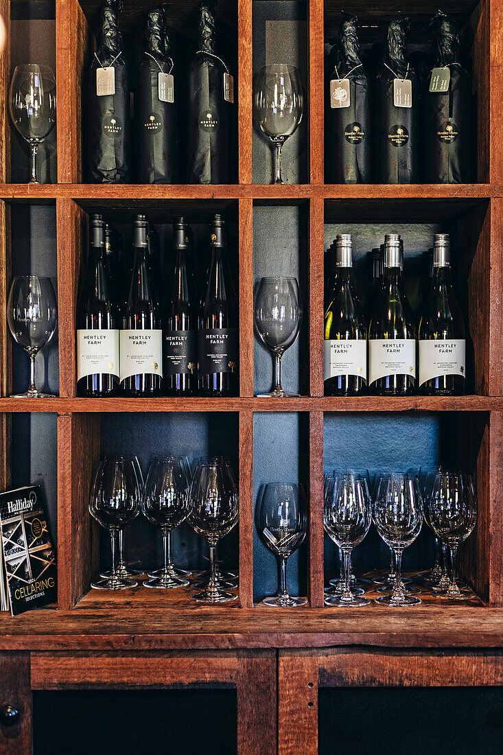 Wine rack with various bottles and glasses