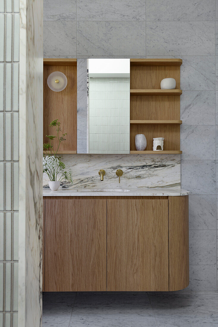 Bathroom with marble and wooden accents